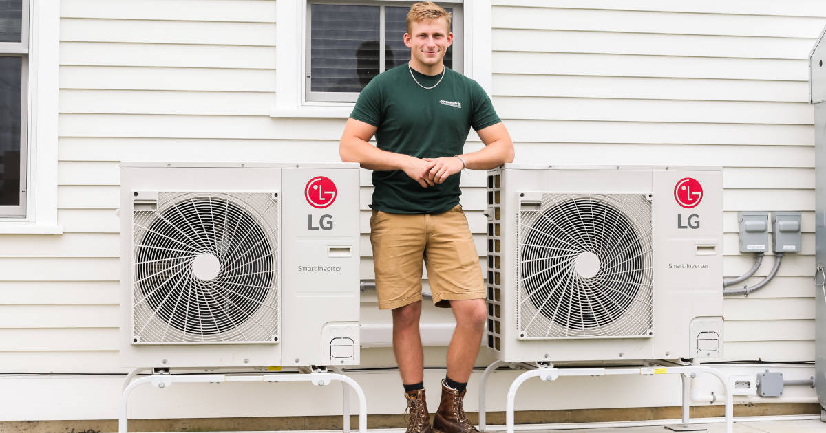 man with air conditioning units