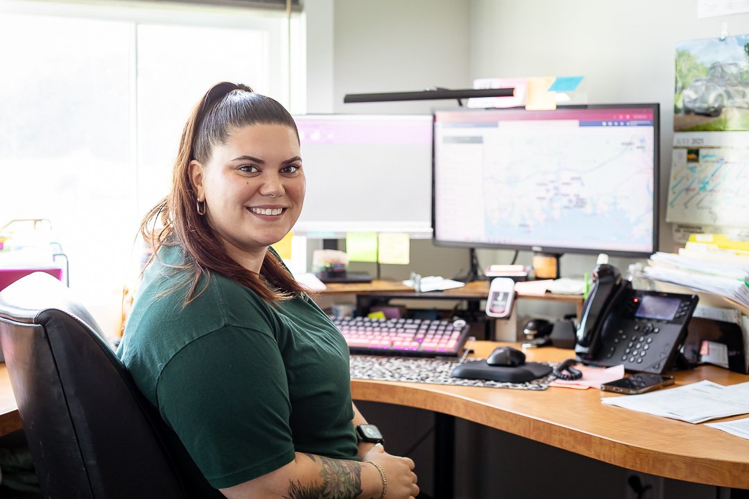 Professional Secretary smiling at desk